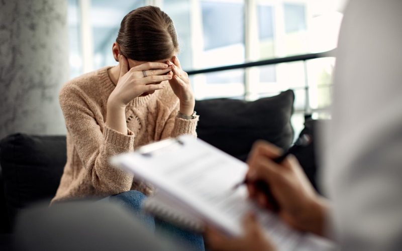 depressed-woman-having-psychotherapy-session-doctor-s-office_637285-9909